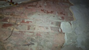 Plaster collapse, exposing a previously exterior wall now an interior wall separating the oldest section of house to late 19th century addition 